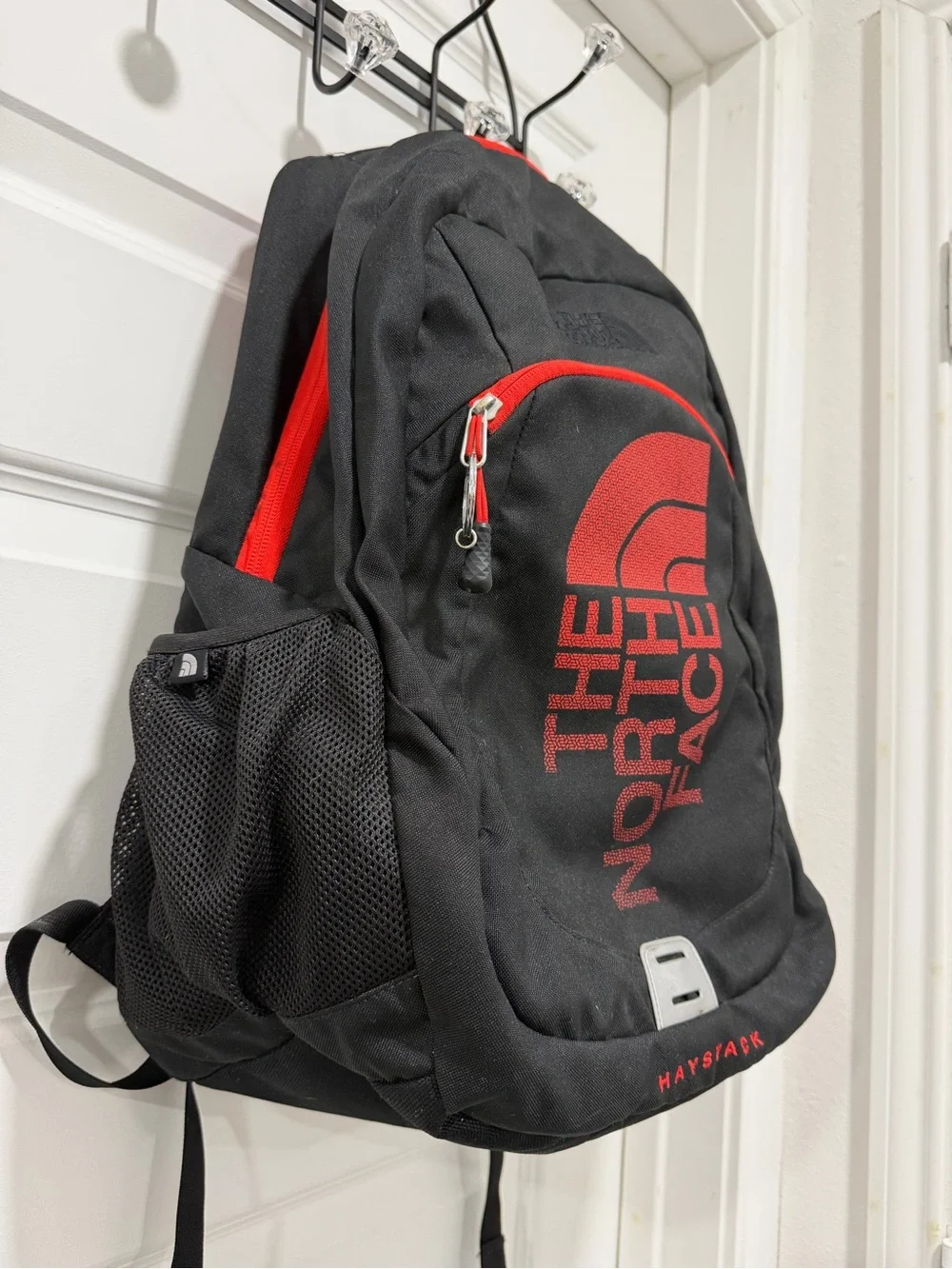 The North Face Haystack Backpack Vertical logo Black and Red